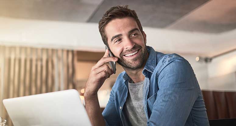 happy customer on the phone from virtual call center services