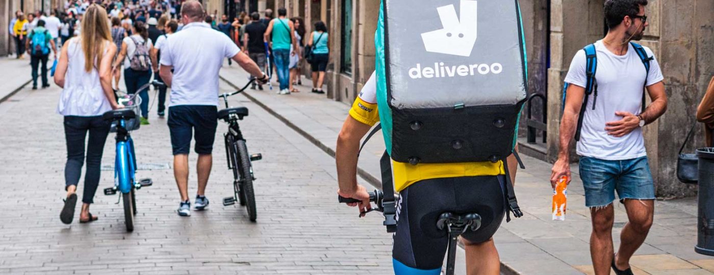 man delivering food on bicycle
