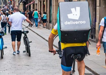 man delivering food on bicycle