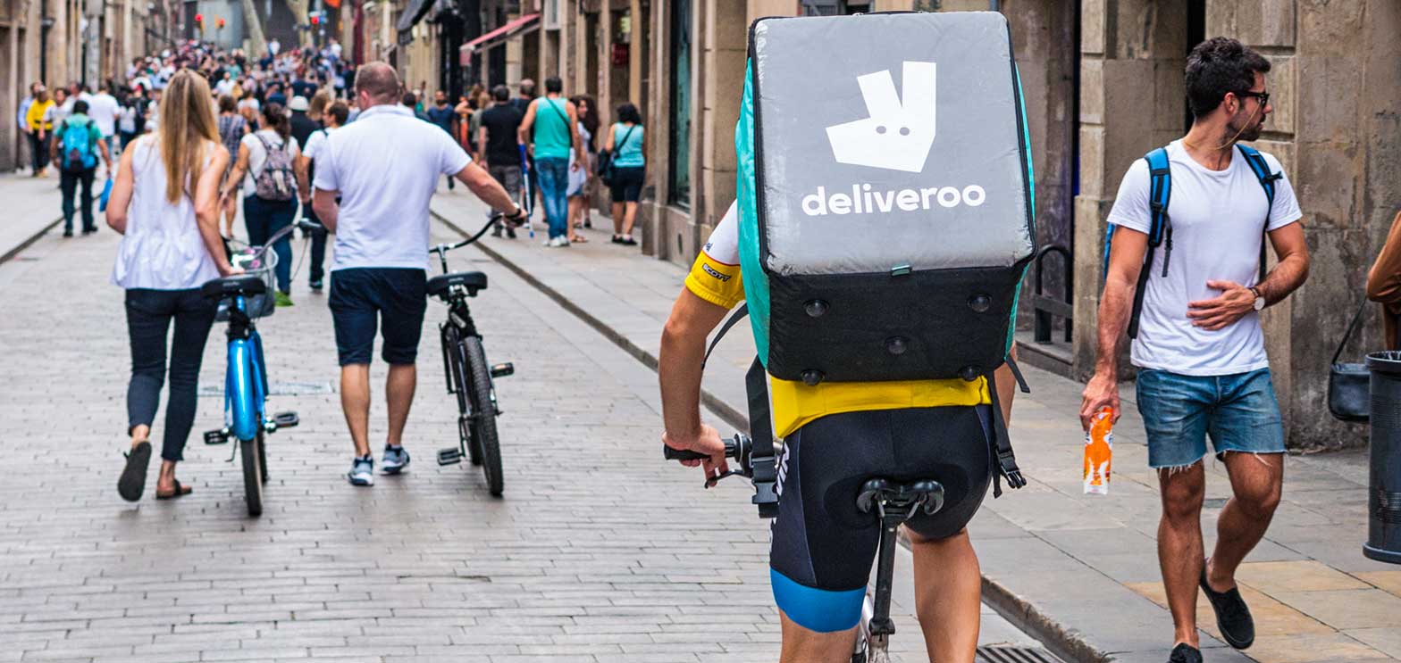 man delivering food on bicycle