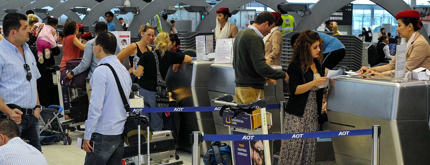 people checking in at international airport