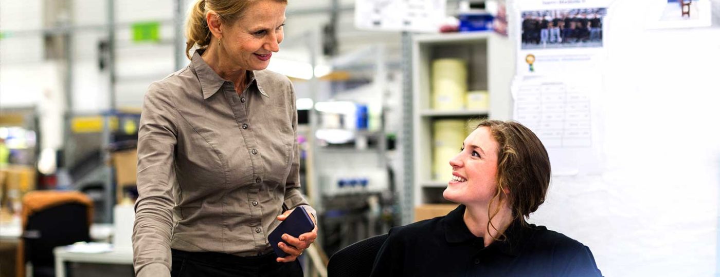 happy employee with boss empathetic work environment