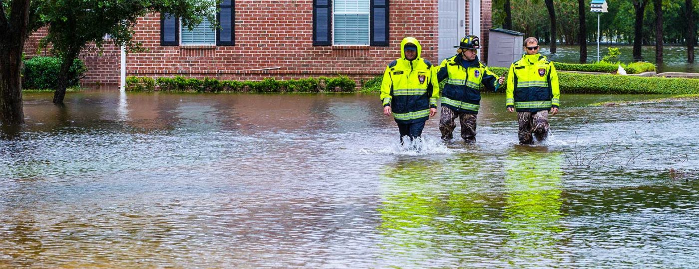 police men responding during disaster recovery city plan business continuity walking in flooded streets
