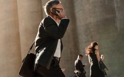 business man with mobile phone in hand getting virtual on demand call center solutions