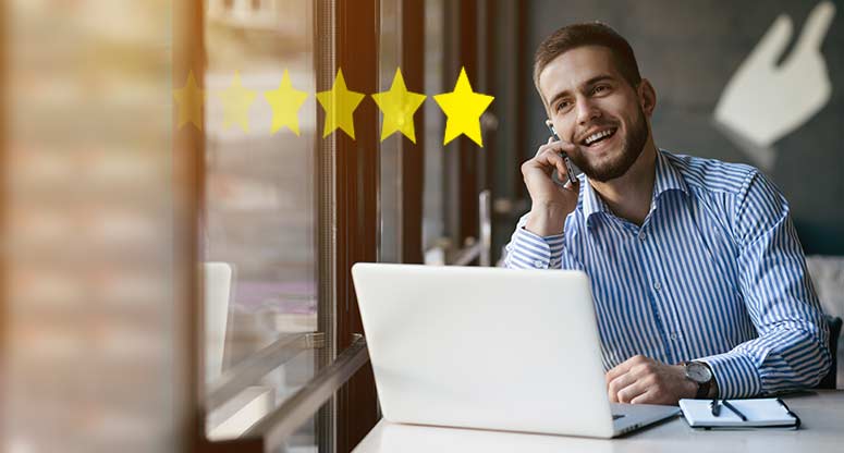 Business man on phone rating customer experience 5 stars