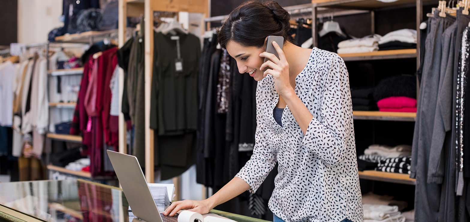 woman working at a retail store getting services from on demand contact center