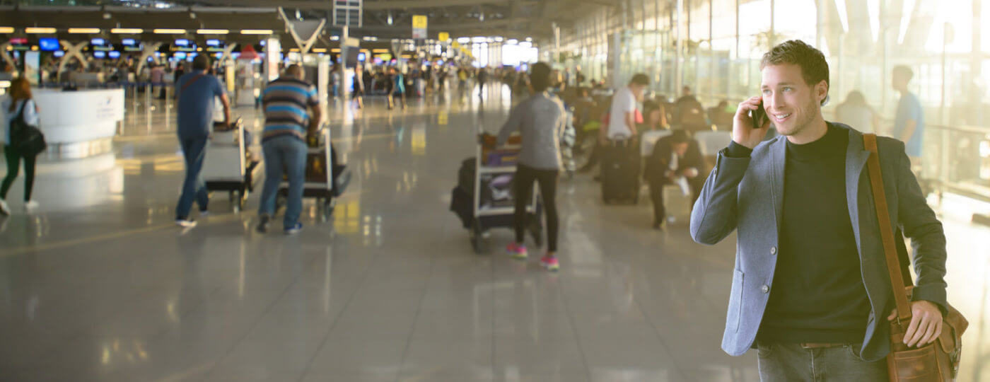 man at the airport talking to an on demand contact center solutions