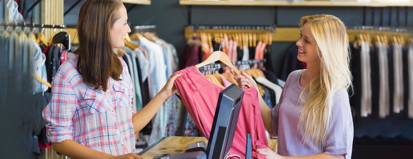 retail woman providing exceptional customer experience to upselll merchandise