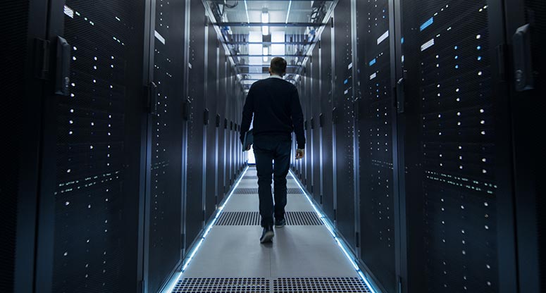 man working in data center room to ensure data security