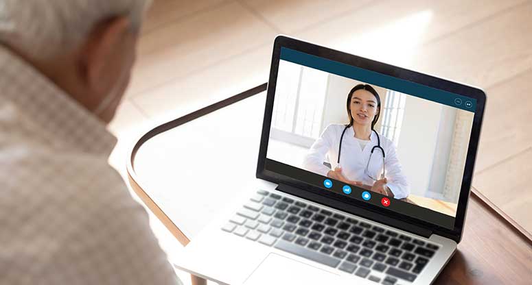 nurse helping patient over a video chat
