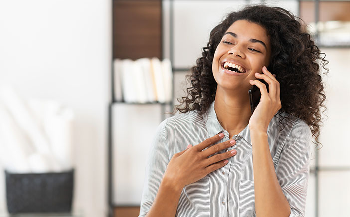 Woman on phone laughing