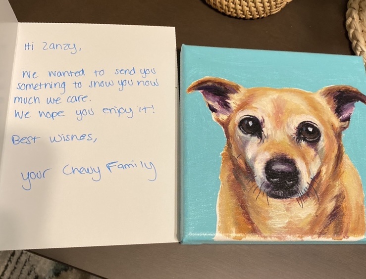 Chihuahua painting alongside a card from Chewy