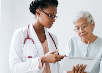 Female doctor competently informs patient of diagnosis results in a doctor's office
